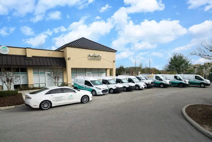 Florida Vacation Homes property management office with branded service vehicles in Davenport Florida