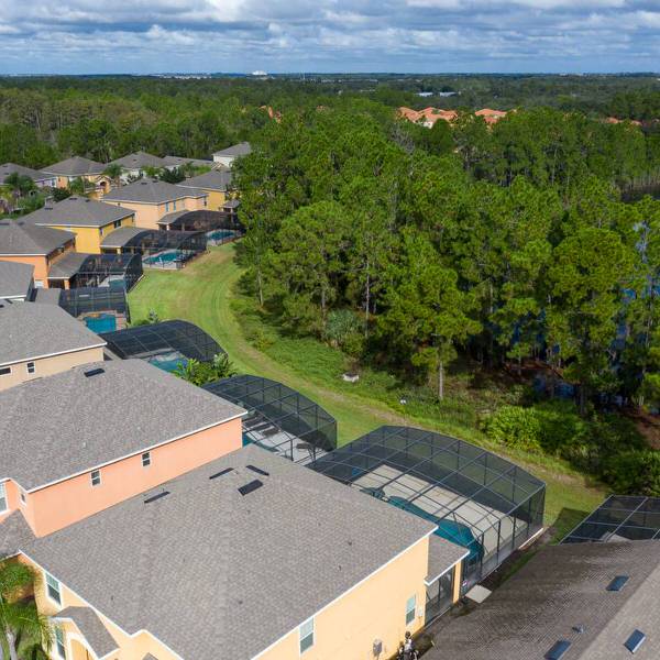 Aerial view of homes in Watersong Resort Davenport Florida backing onto conservation area