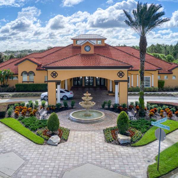 Watersong Resort clubhouse entrance in Davenport Florida with fountain and landscaped grounds