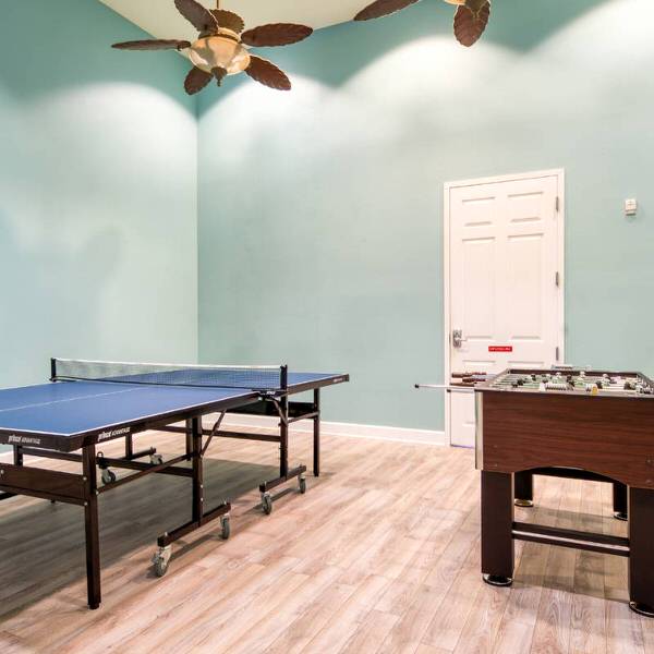 Indoor game room at Watersong Resort Davenport Florida featuring table tennis and foosball for guest entertainment