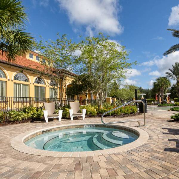 Relaxing hot tub and poolside area in Davenport Florida vacation rental community at Watersong Resort