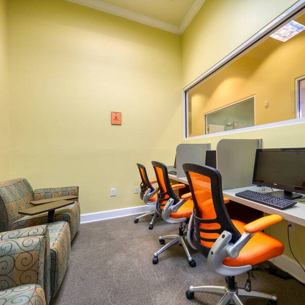 Convenient computer room at Watersong vacation community with internet access and seating area