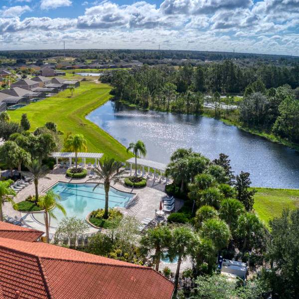 Vacation rental community in Davenport Florida featuring pool, lake, and scenic surroundings