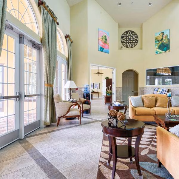 Resort-style clubhouse interior at Watersong Davenport Florida featuring welcoming seating and upscale design