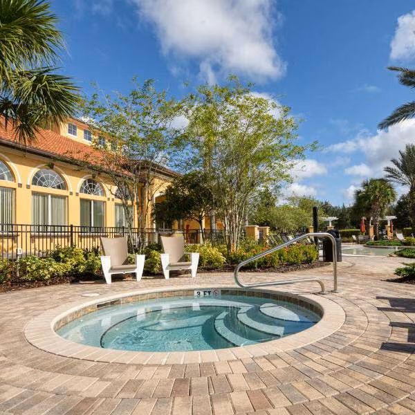 Relaxing hot tub and poolside area in Davenport Florida vacation rental community at Watersong Resort